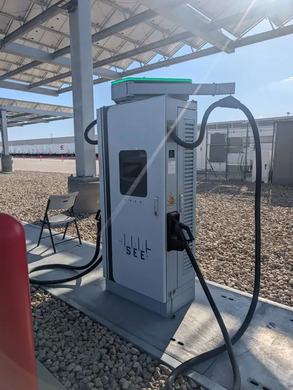 Installed SEE EV charger beneath a canopy