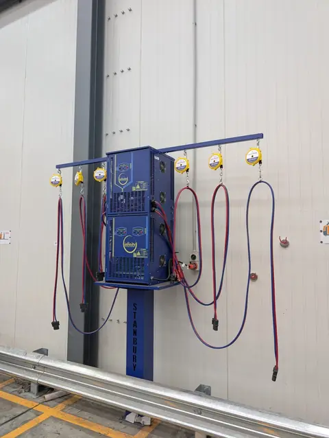 Stacked Stanbury chargers with six yellow cable retractors