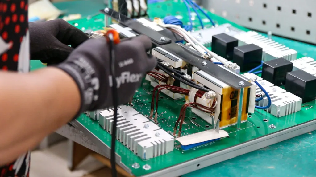 Industrial charger power electronics being assembled